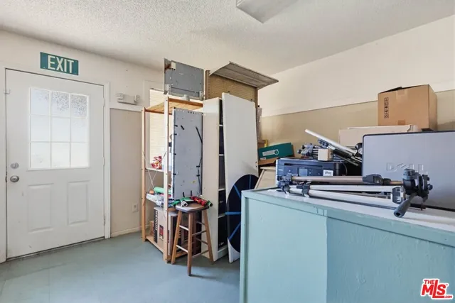a kitchen filled with a stove and a refrigerator