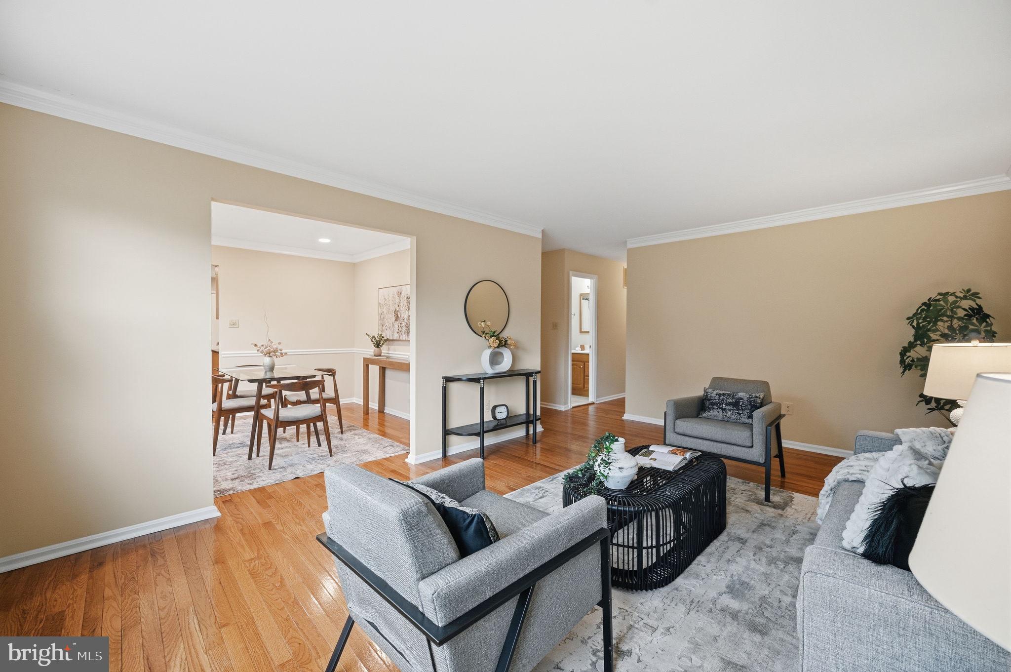 9322 Elk Drive Springfield, VA 22153 - Photo 11 of 43 a living room with furniture a rug and a table