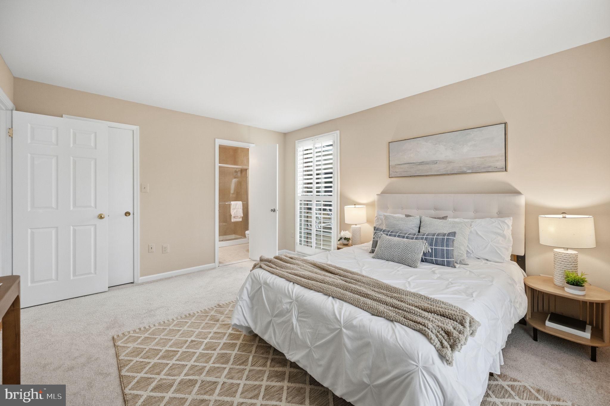 9322 Elk Drive Springfield, VA 22153 - Photo 20 of 43 a bedroom with a bed and a night stand