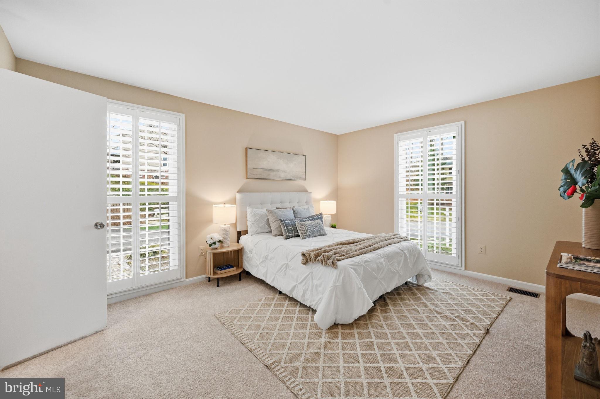 9322 Elk Drive Springfield, VA 22153 - Photo 21 of 43 a bedroom with a bed and a window