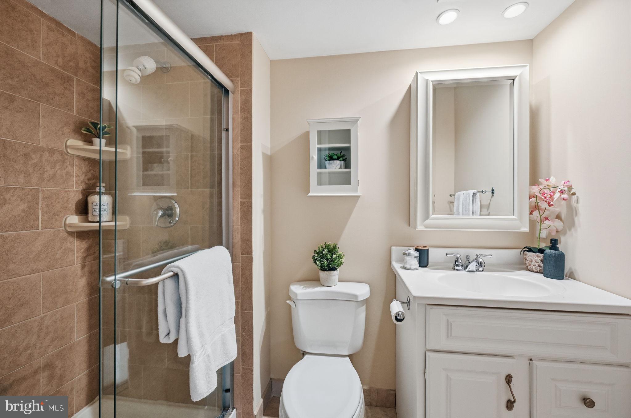 9322 Elk Drive Springfield, VA 22153 - Photo 30 of 43 a bathroom with a toilet sink and shower