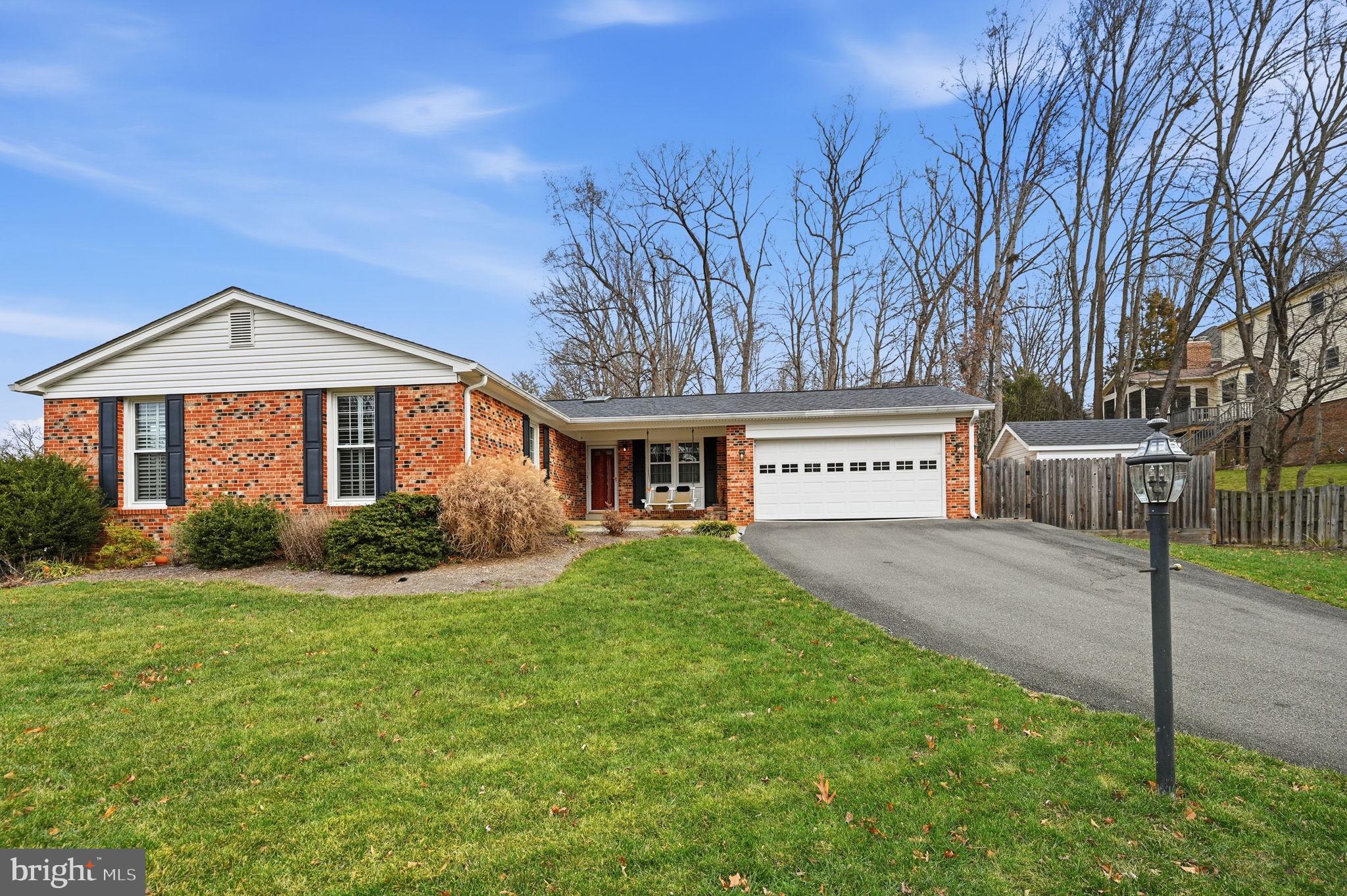 9322 Elk Drive Springfield, VA 22153 - Photo 42 of 43 a view of a house with a yard and pathway
