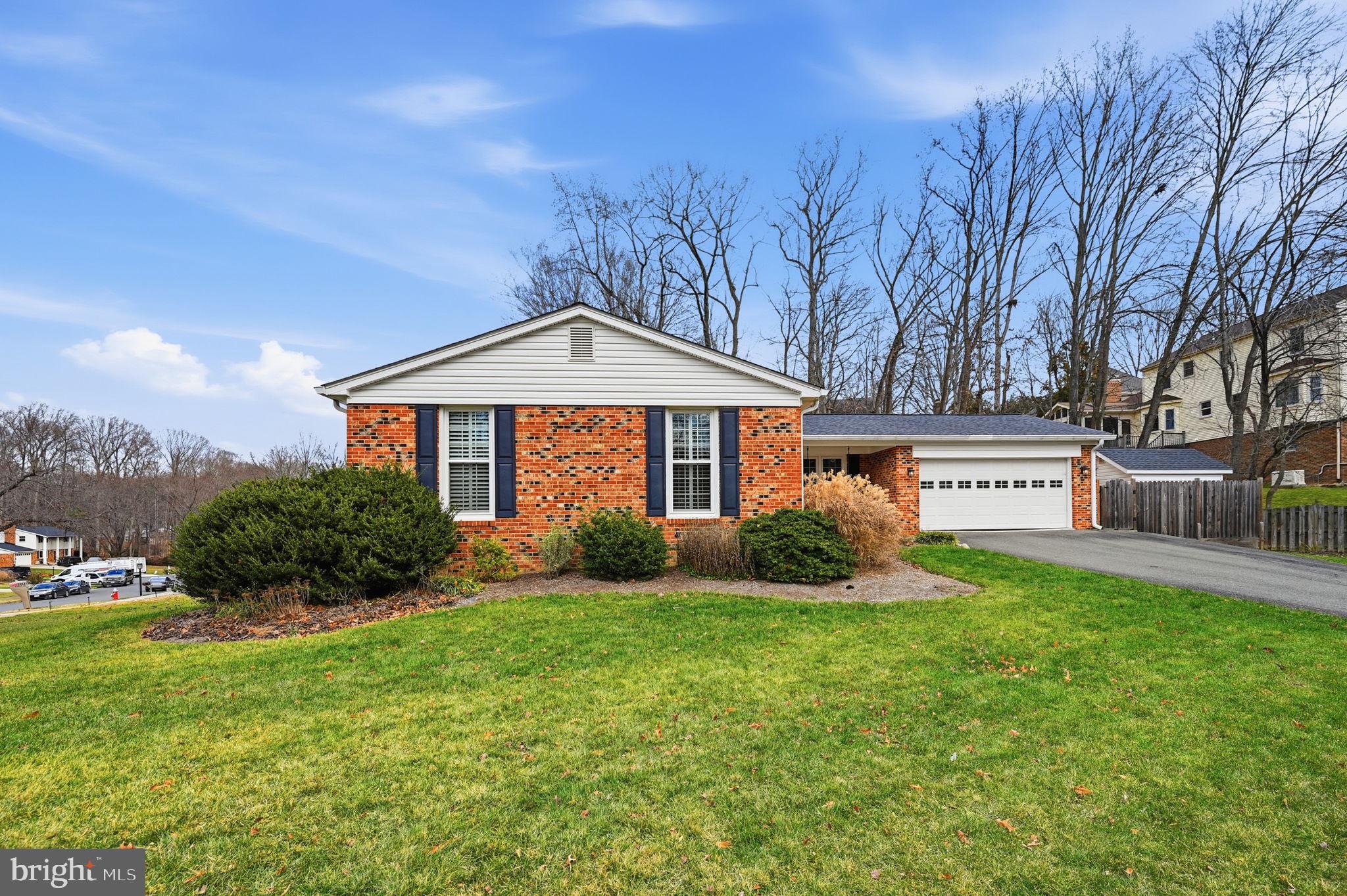 9322 Elk Drive Springfield, VA 22153 - Photo 43 of 43 a front view of a house with a yard