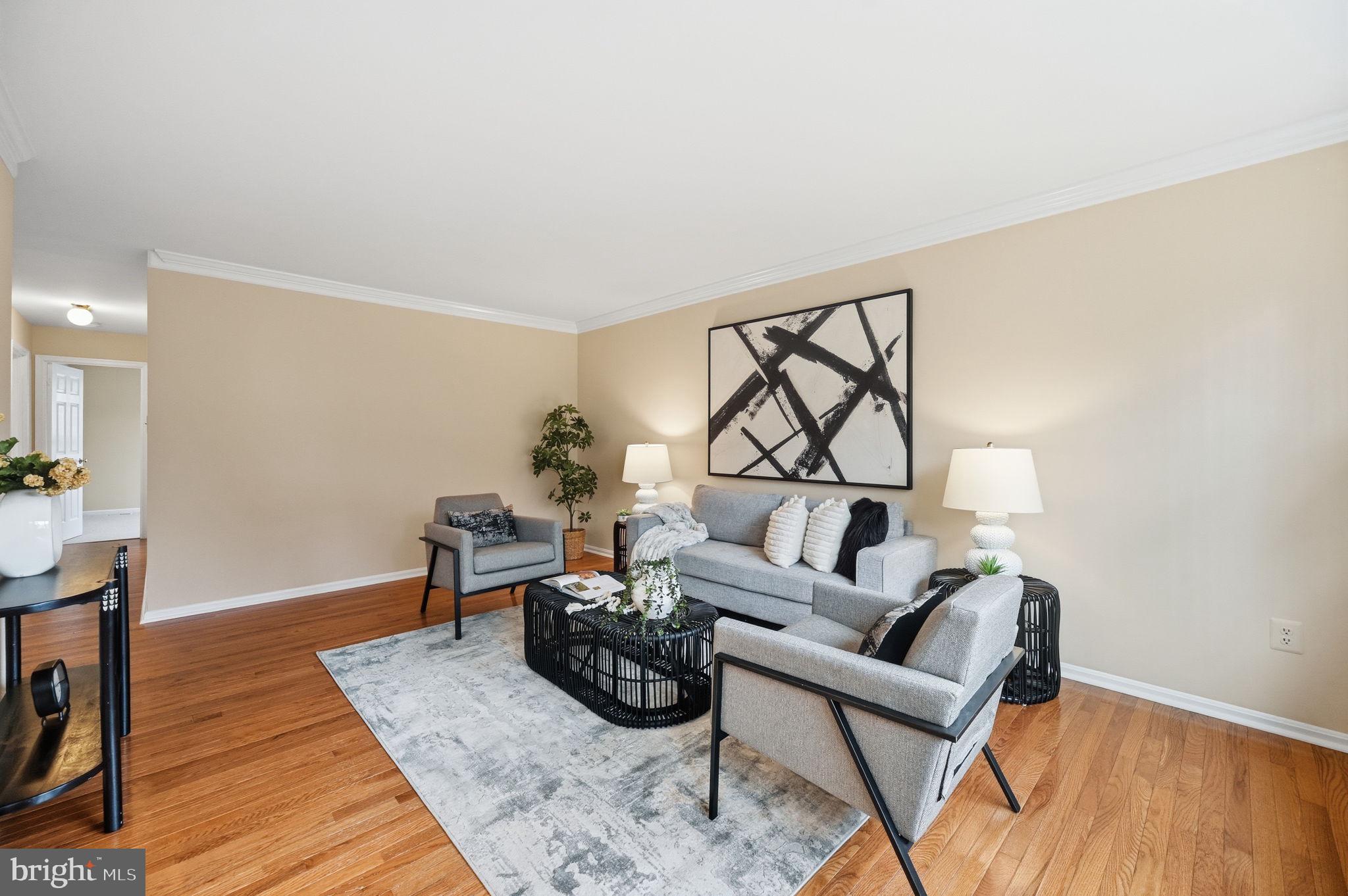9322 Elk Drive Springfield, VA 22153 - Photo 10 of 43 a living room with furniture and a wooden floor