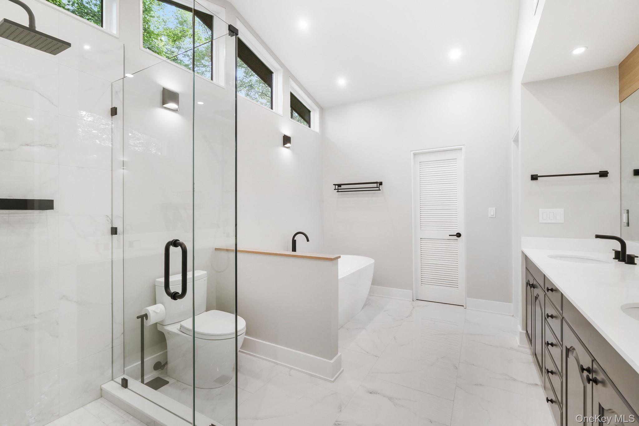 2 Logging Road Waccabuc, NY 10597 - Photo 26 of 46 a bathroom with a sink a toilet and shower