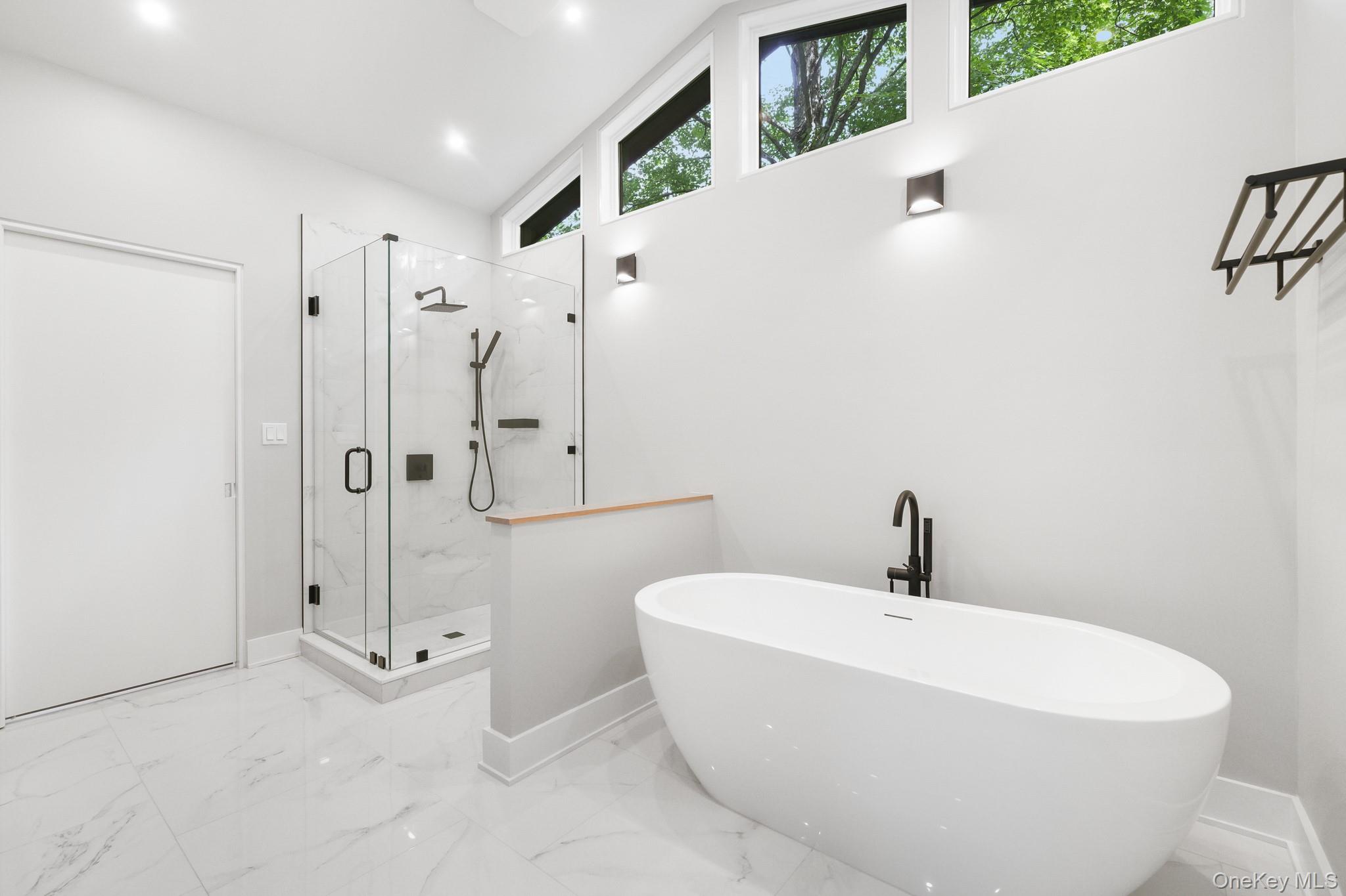 2 Logging Road Waccabuc, NY 10597 - Photo 27 of 46 a white bath tub sitting next to a white sink
