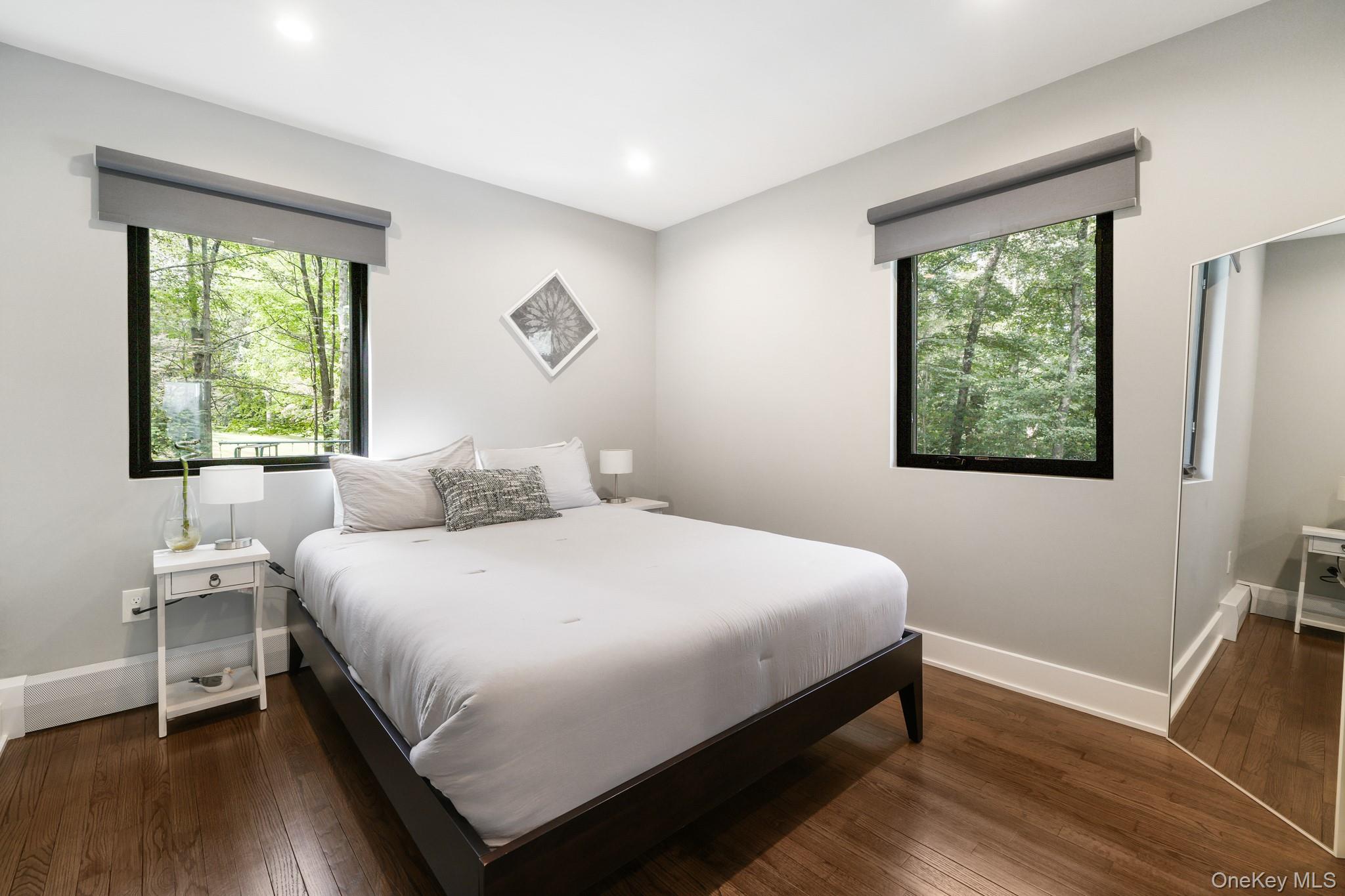 2 Logging Road Waccabuc, NY 10597 - Photo 36 of 46 a large bed sitting in a bedroom next to a window
