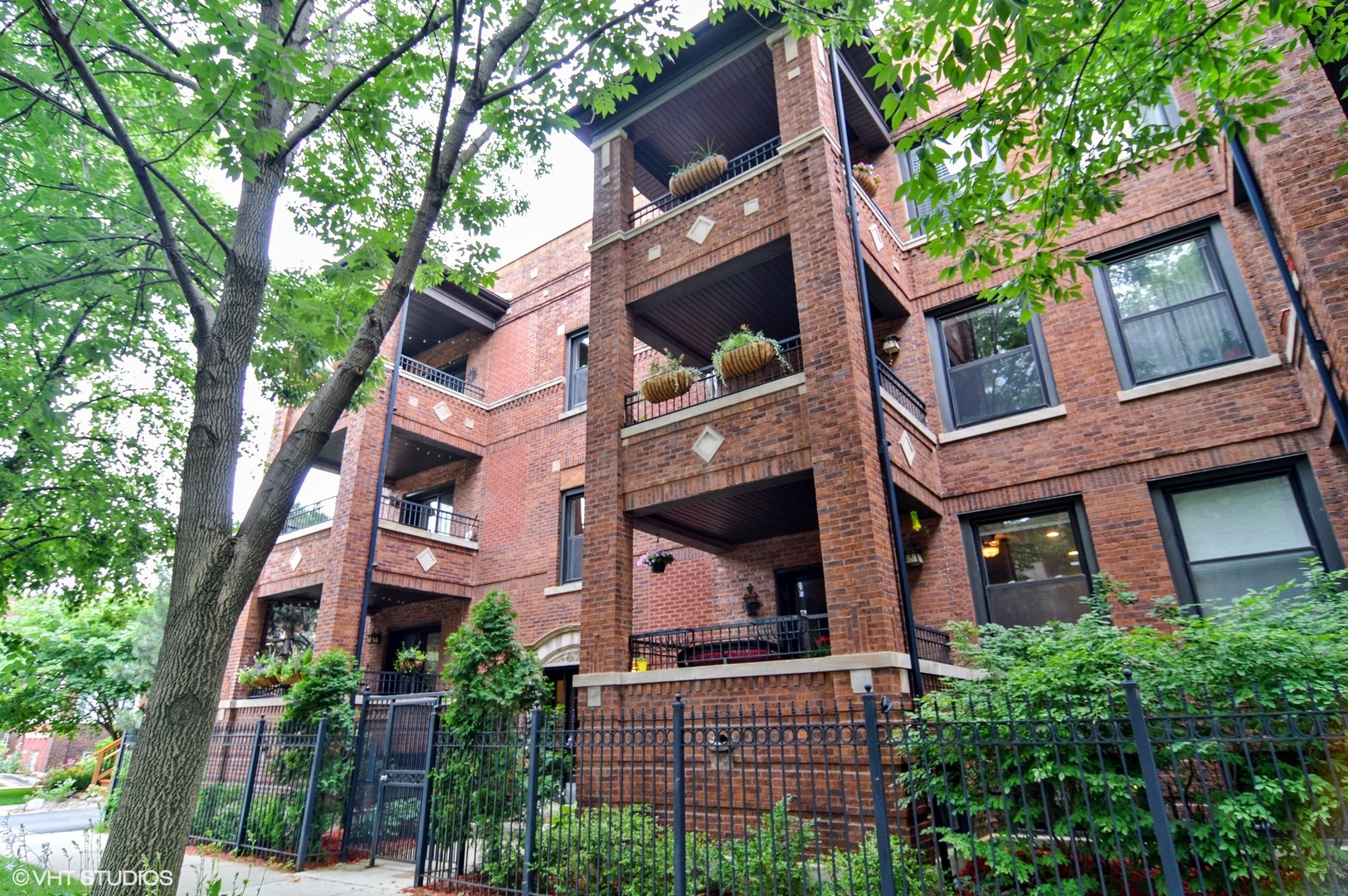 4544 North Spaulding Avenue, Unit 1 Chicago, IL 60625 - Photo 2 of 5 front view of a building with a tree