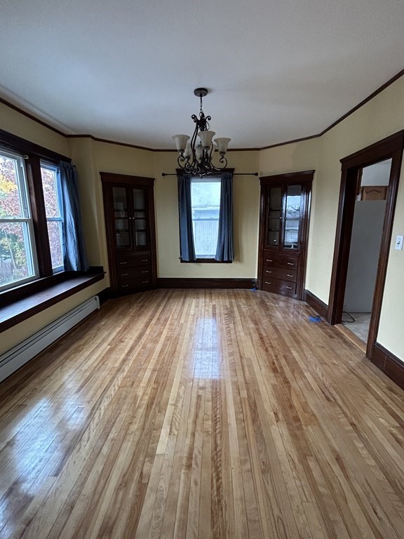 23 Greendale Avenue Worcester, MA 01606 - Photo 11 of 30 wooden floor in an empty room with a window