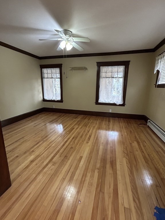 23 Greendale Avenue Worcester, MA 01606 - Photo 13 of 30 wooden floor in an empty room with a window