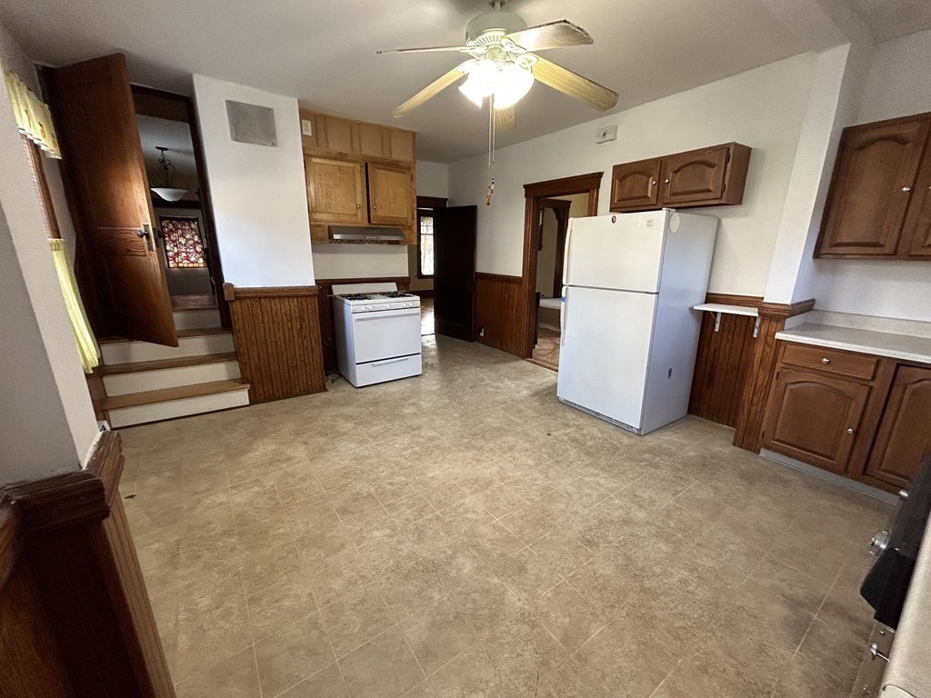 23 Greendale Avenue Worcester, MA 01606 - Photo 14 of 30 a view of a kitchen with fridge and wooden floor