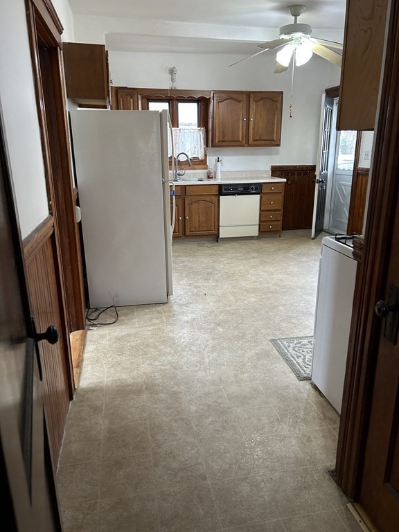 23 Greendale Avenue Worcester, MA 01606 - Photo 18 of 30 a kitchen with a refrigerator and a sink
