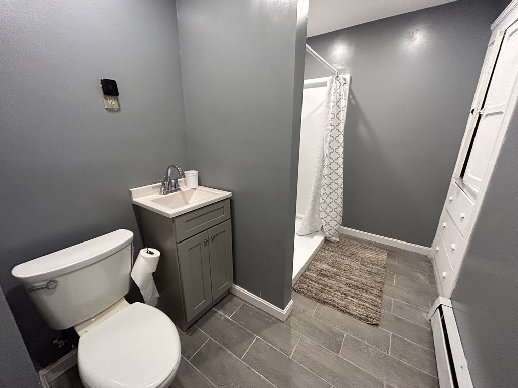 23 Greendale Avenue Worcester, MA 01606 - Photo 22 of 30 a bathroom with a toilet sink and shower