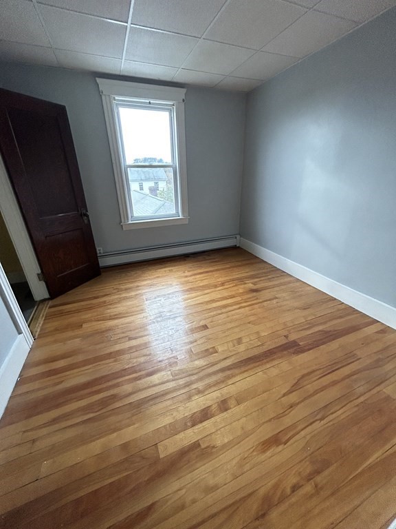 23 Greendale Avenue Worcester, MA 01606 - Photo 24 of 30 an empty room with wooden floor and windows
