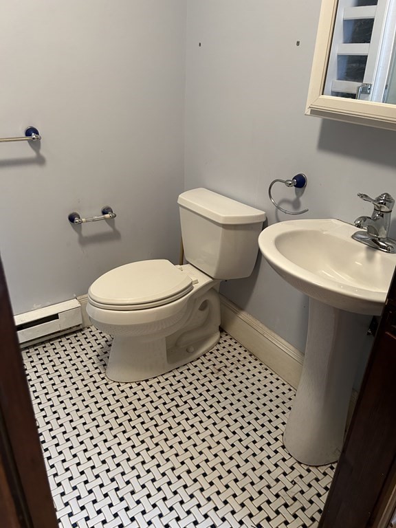 23 Greendale Avenue Worcester, MA 01606 - Photo 25 of 30 a bathroom with a toilet a sink and a mirror