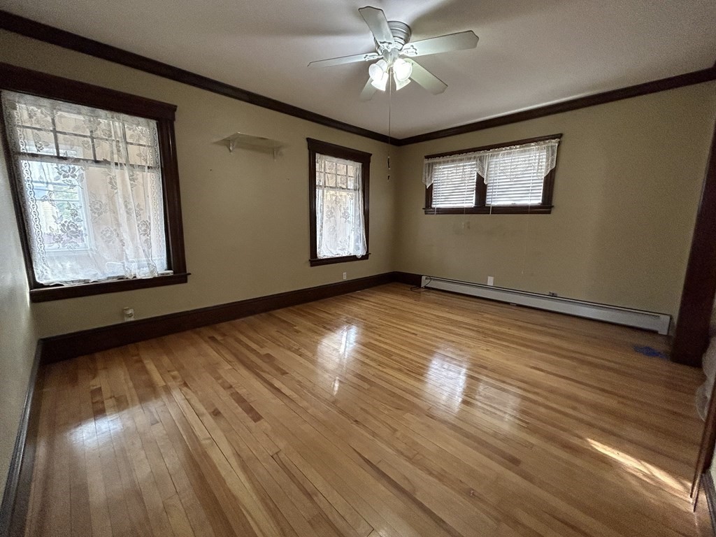 23 Greendale Avenue Worcester, MA 01606 - Photo 7 of 30 a view of an empty room with wooden floor and a window