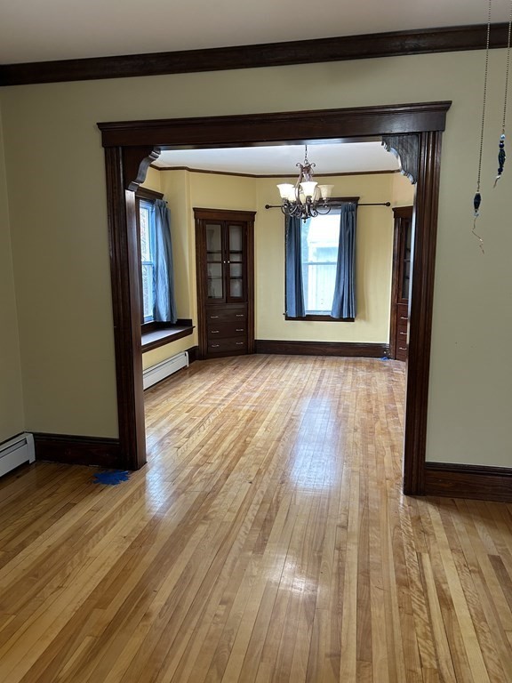 23 Greendale Avenue Worcester, MA 01606 - Photo 9 of 30 a view of an empty room with wooden floor and a window