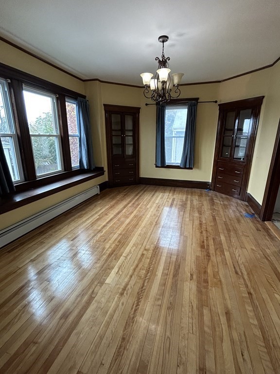 23 Greendale Avenue Worcester, MA 01606 - Photo 10 of 30 wooden floor in an empty room with a window