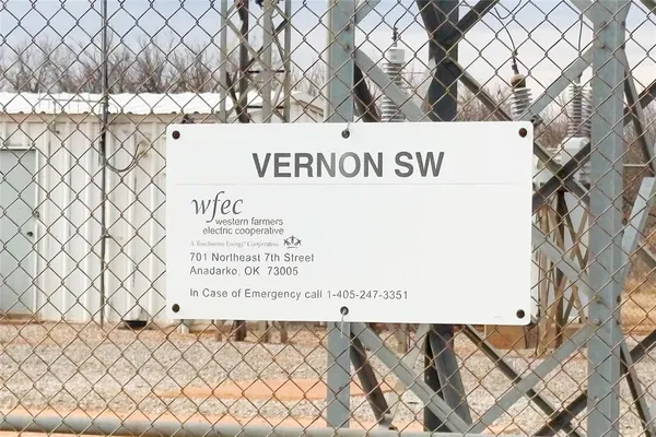 a view of a green field with lots of trees in it