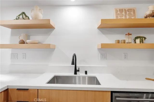 a kitchen with a sink and cabinets