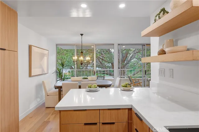 a kitchen with a large window and a counter space