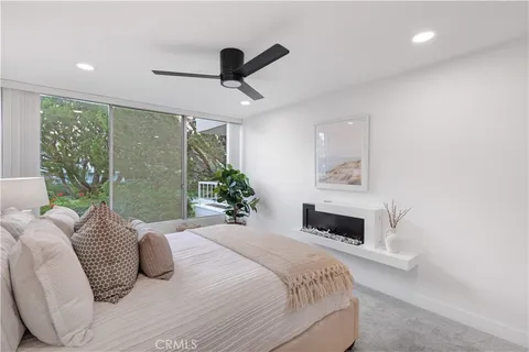 a bedroom with a bed and a night stand