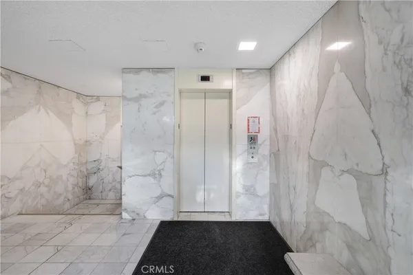 a view of a bathroom with a shower and a toilet