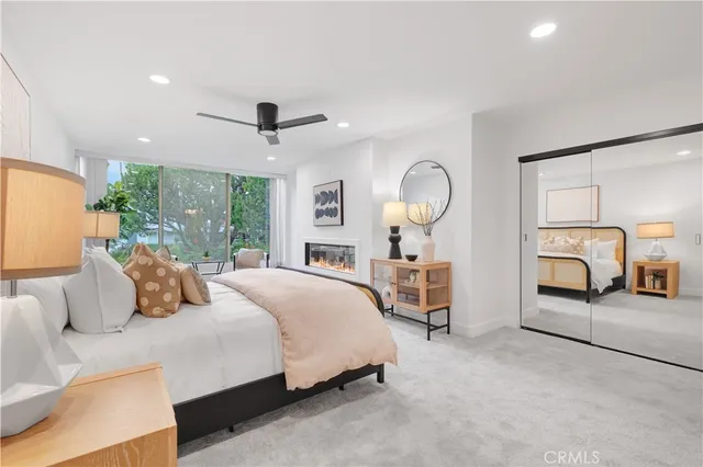 a bedroom with furniture and a fireplace