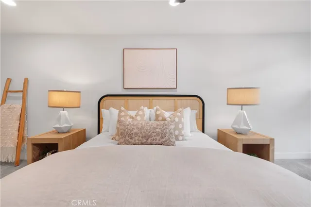 a living room with furniture and a painting