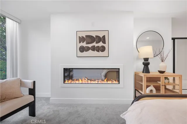 a spacious bedroom with a bed and a ceiling fan