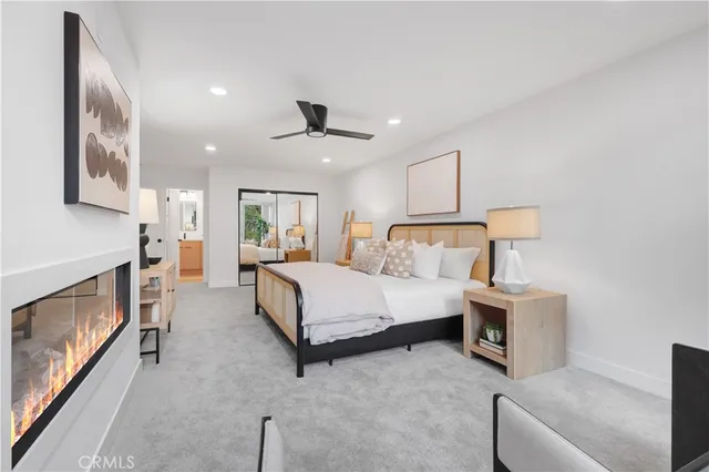 a bathroom with a double vanity sink and mirror with shower