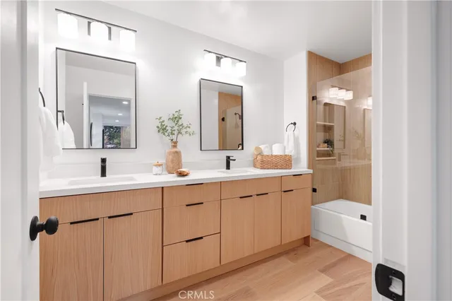 a view of a house with a large window and tree s