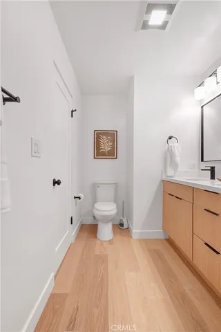 a front view of a house with a fountain and porch