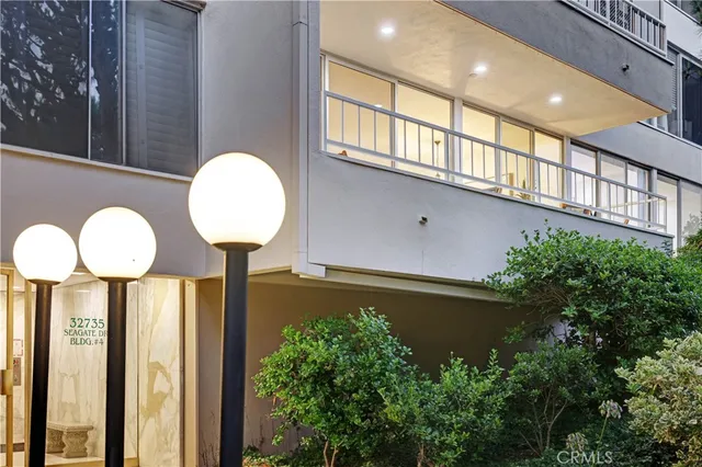 a view of a patio with couches table and chairs and potted plants