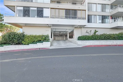 an aerial view of multiple houses with yard