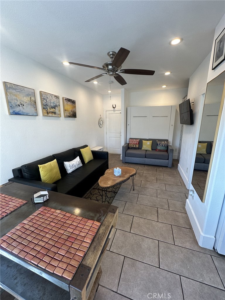 354 Chestnut Avenue, Unit 33 Long Beach, CA 90802 - Photo 4 of 18 a living room with furniture and a rug