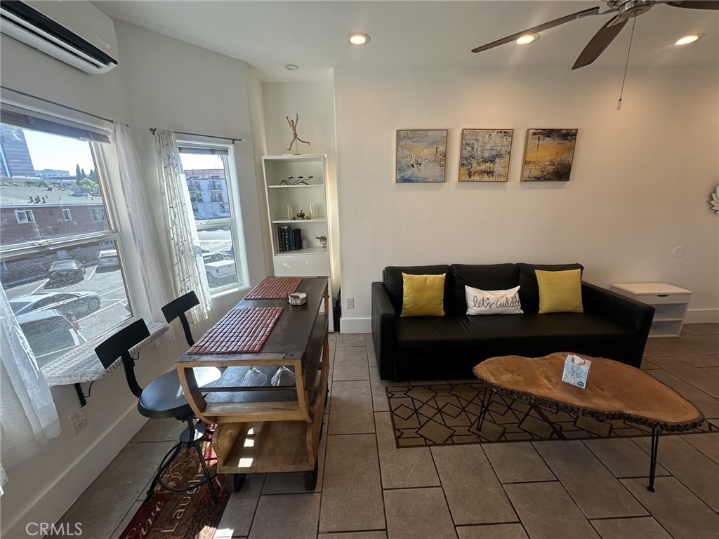 354 Chestnut Avenue, Unit 33 Long Beach, CA 90802 - Photo 7 of 18 a living room with furniture and a rug