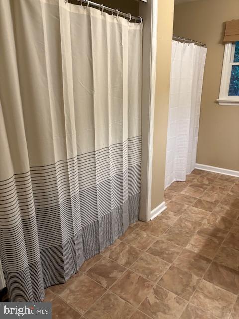 287 Blackthorne Road, Unit LURAY Stanley, VA 22851 - Photo 20 of 96 Bathroom with stylish laundry & shower curtains.