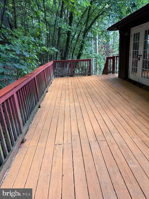 287 Blackthorne Road, Unit LURAY Stanley, VA 22851 - Photo 49 of 96 Rear deck bordered by hillside trees.