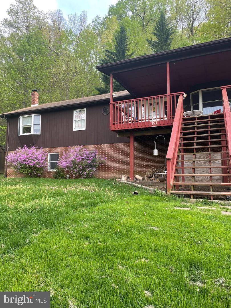287 Blackthorne Road, Unit LURAY Stanley, VA 22851 - Photo 67 of 96 a front view of a house with a garden and yard