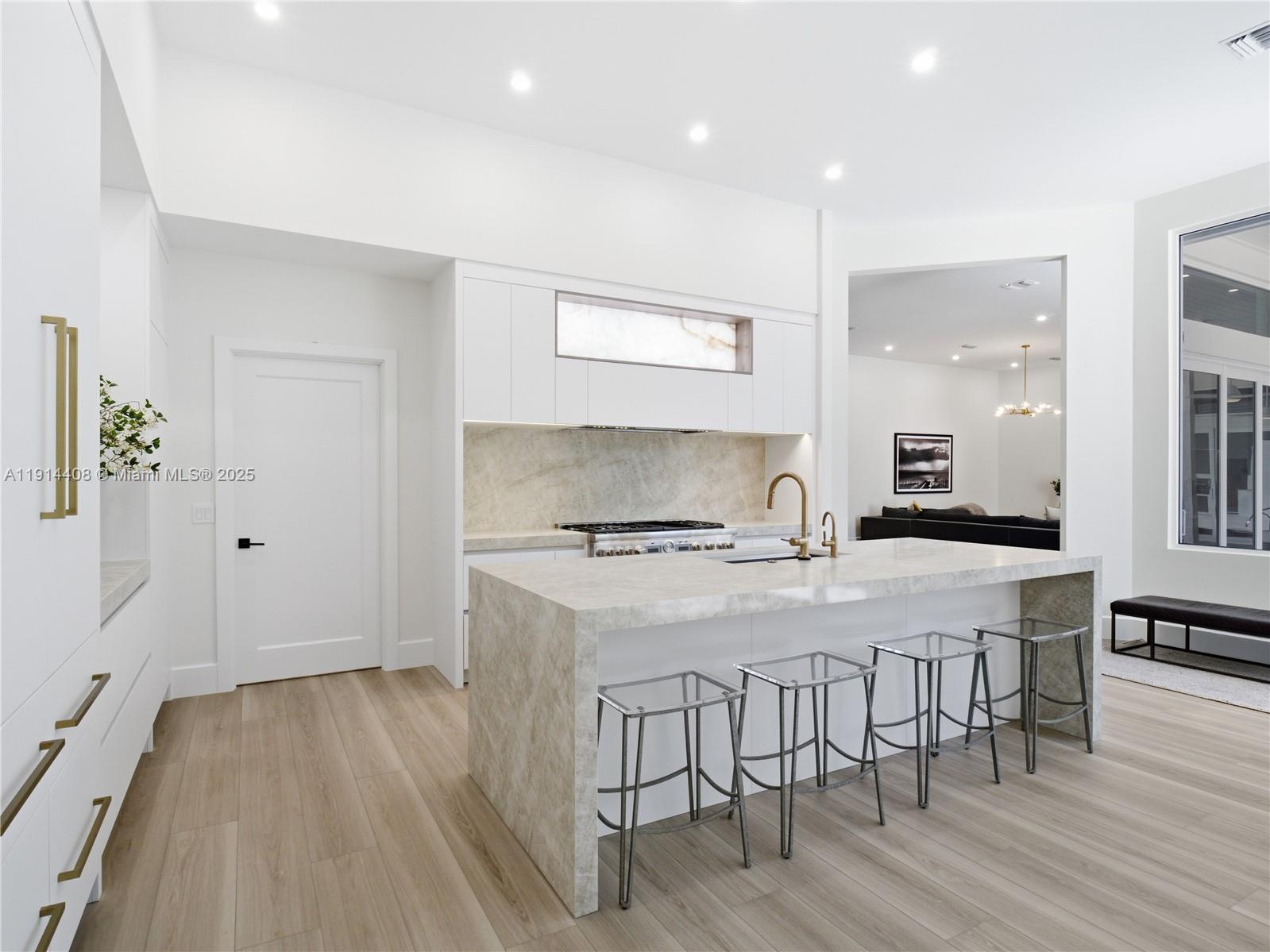 7675 Steeplechase Drive Palm Beach Gardens, FL 33418 - Photo 14 of 36 a kitchen with a table and chairs in it