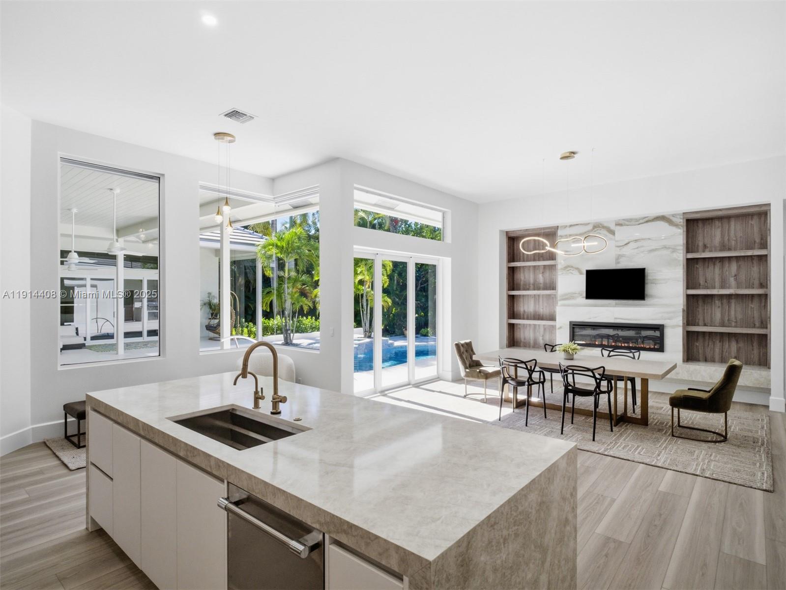 7675 Steeplechase Drive Palm Beach Gardens, FL 33418 - Photo 15 of 36 a living room with furniture and large windows