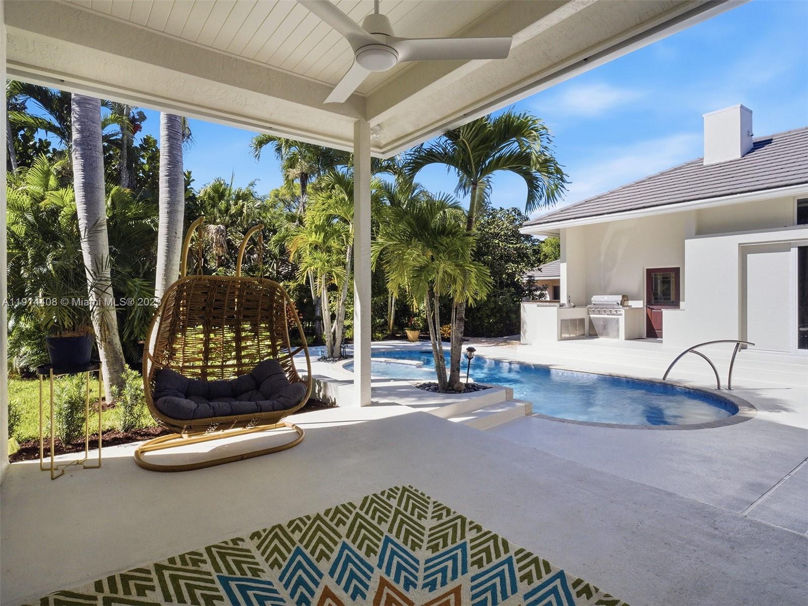 7675 Steeplechase Drive Palm Beach Gardens, FL 33418 - Photo 28 of 36 a living room with couch