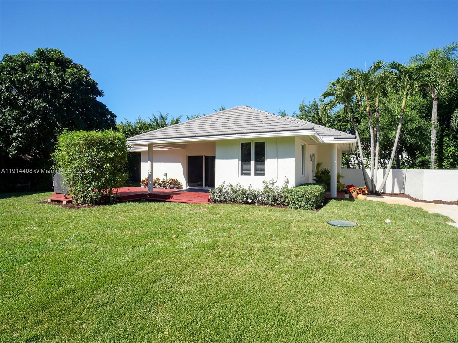 7675 Steeplechase Drive Palm Beach Gardens, FL 33418 - Photo 36 of 36 a front view of a house with garden