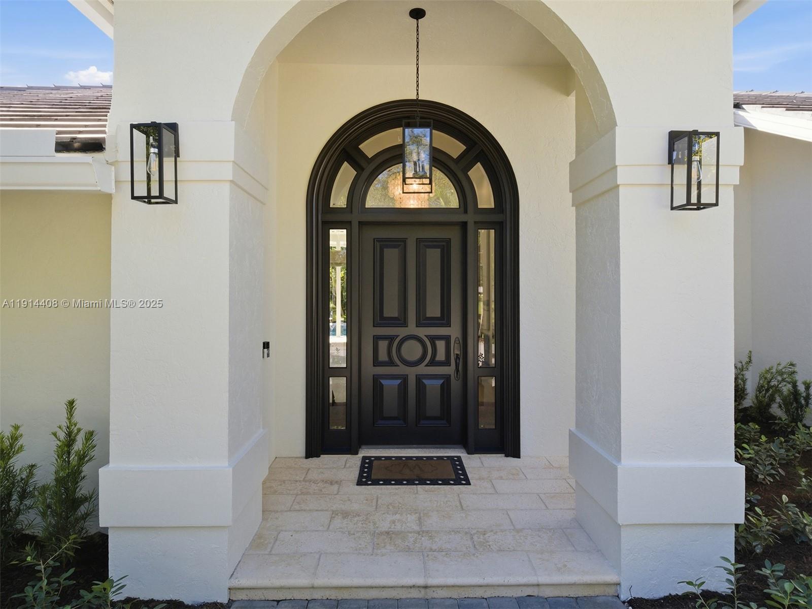 7675 Steeplechase Drive Palm Beach Gardens, FL 33418 - Photo 5 of 36 a view of entryway with garden