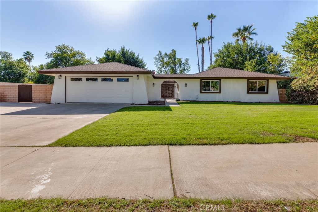 1190 Vía Pintada Riverside, CA 92507 - Photo 1 of 1 a front view of a house with a yard and garage
