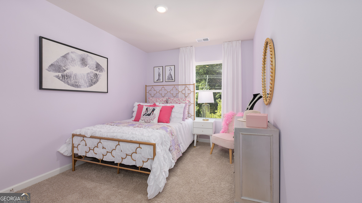 2080 Moss Hill Road Stone Mountain, GA 30088 - Photo 32 of 39 a bedroom with a bed and a painting on the wall