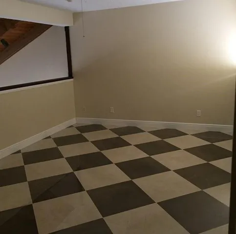 a bathroom with a shower and a sink