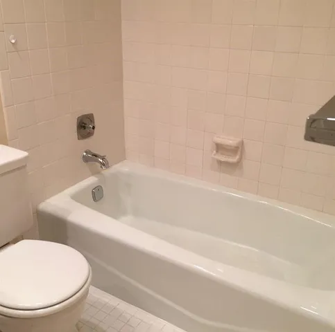 a view of an empty room with a black and white checkered floor