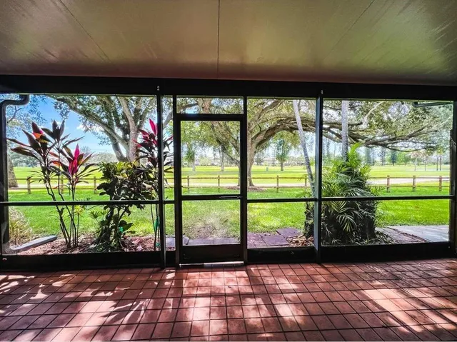 a view of a room with a large window